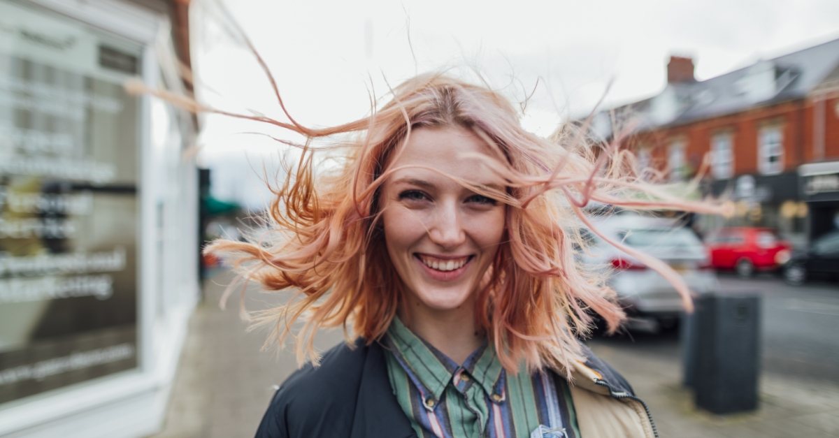 woman standing outside in the wind